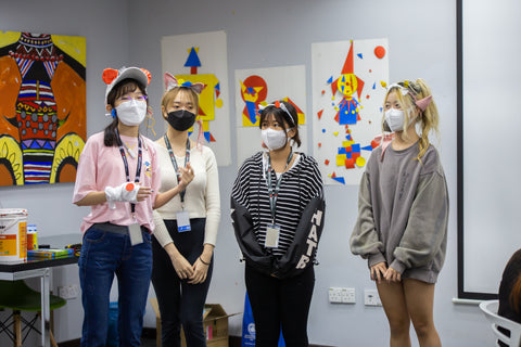 Students showcasing their Key Signature Accessories